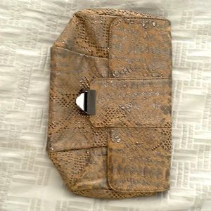 Attractive Lauren Merkin clutch bag with inside zipper and pewter closure.